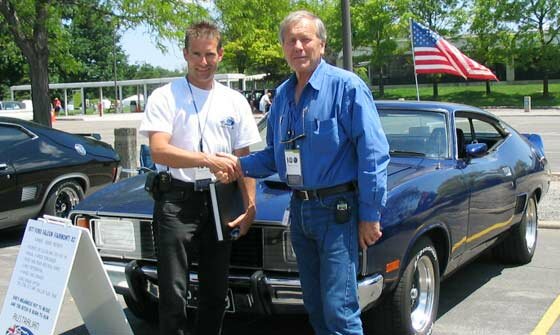 John Goss greeting a fan at the Ford 100th Anniversary